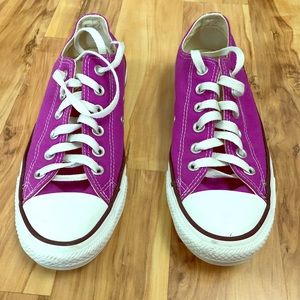 A pair of brand new purple Converse